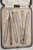 A boxed set of C19th silver plated shellfish tools and crackers, 5½" long