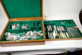 A good military style oak canteen case containing a quantity of various silver plated cutlery part