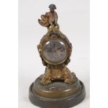 An early C19th Empire style gilt spelter cased mantel clock, the case surmounted by a figure of