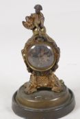An early C19th Empire style gilt spelter cased mantel clock, the case surmounted by a figure of