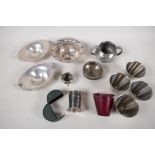 A small quantity of silver plated items to include two cased stirrup cups, a miniature caldron, a