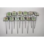 A set of twelve painted cast iron herb markers, 3" x 2½"
