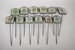 A set of twelve painted cast iron herb markers, 3" x 2½"