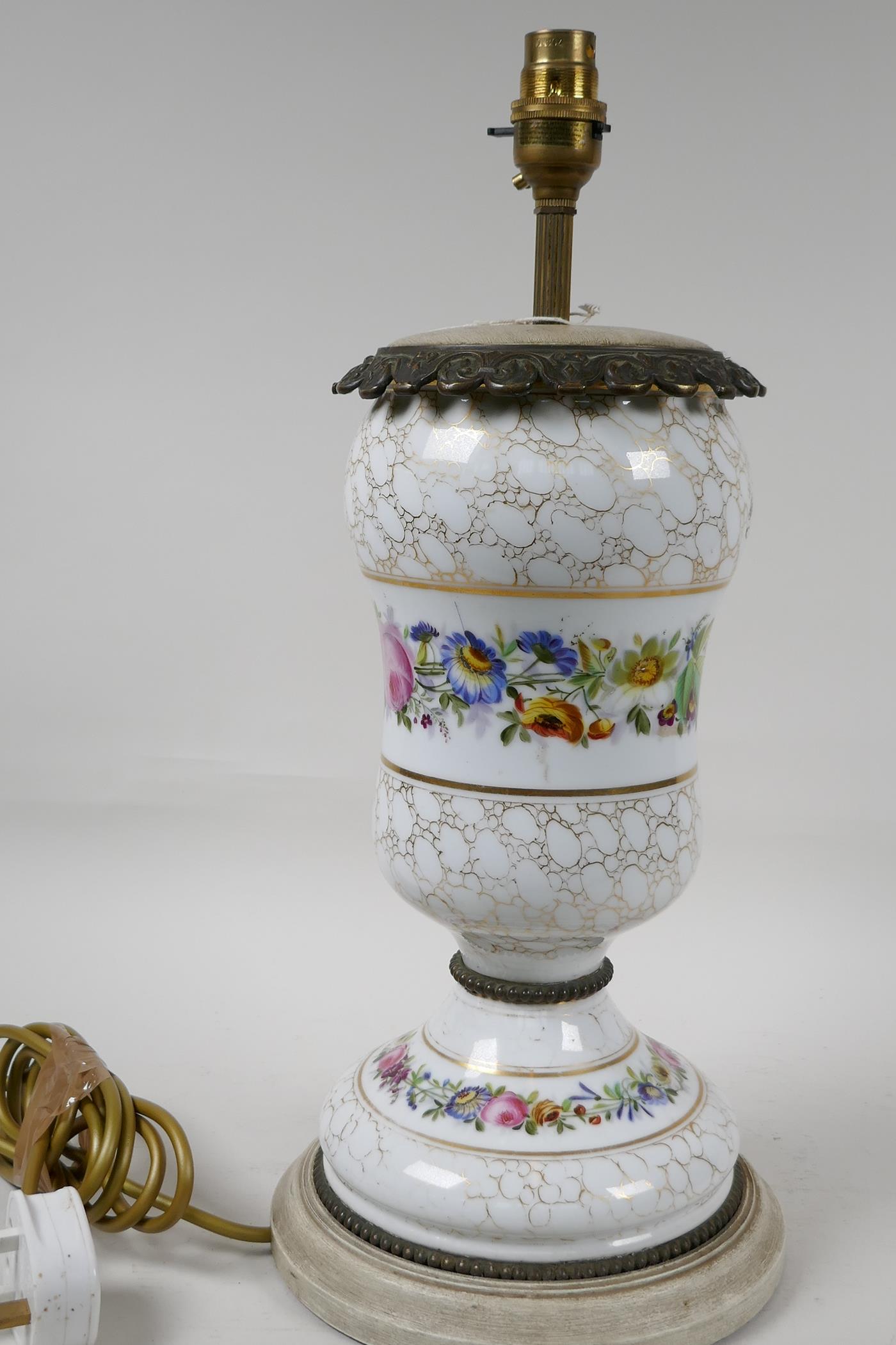 An urn shaped porcelain table lamp with ormolu mounts and painted with garlands of flowers, on a - Image 2 of 3
