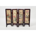 A Chinese hardwood and silk four fold table screen with painted decoration of birds and flowers, 12"