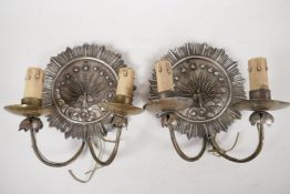 A pair of silver plated two light wall sconces decorated with a sunbird design, 7" diameter