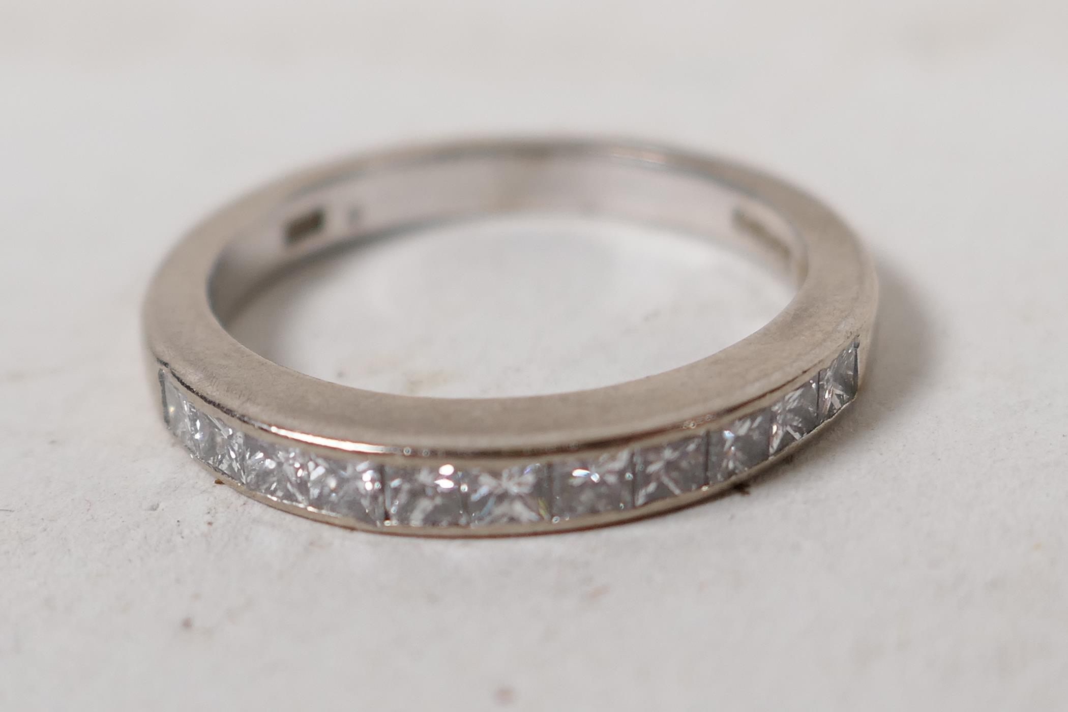 A hallmarked 18ct white gold half eternity ring, set with eleven princess cut diamonds, .5ct - Image 4 of 5