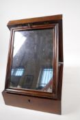 A C19th mahogany vanity box with mirror and fitted trays, 8" x 11" x 3"