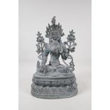 A Sino Tibetan bronze figure of a deity seated on a lotus throne, 15" high