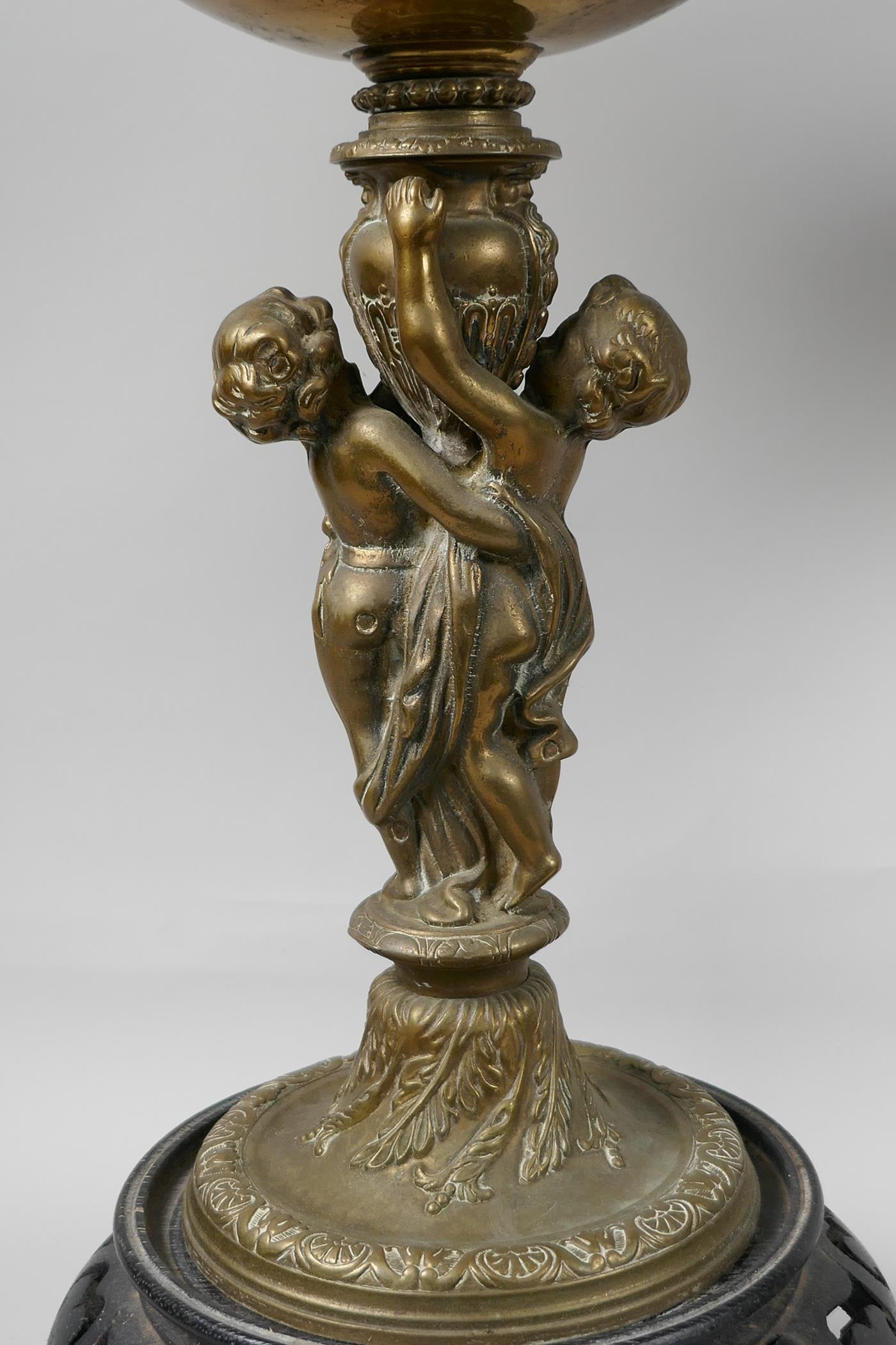 Two table lamps, the central bronze columns cast as two cherubs supporting an urn, with brass oil - Image 3 of 4