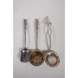 A hallmarked silver Apostle sugar spoon and strainer by Martin, Hall & Co, Sheffield 1895, and