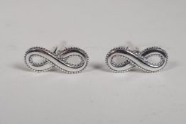 A pair of 925 silver cufflinks in the form of the infinity symbol