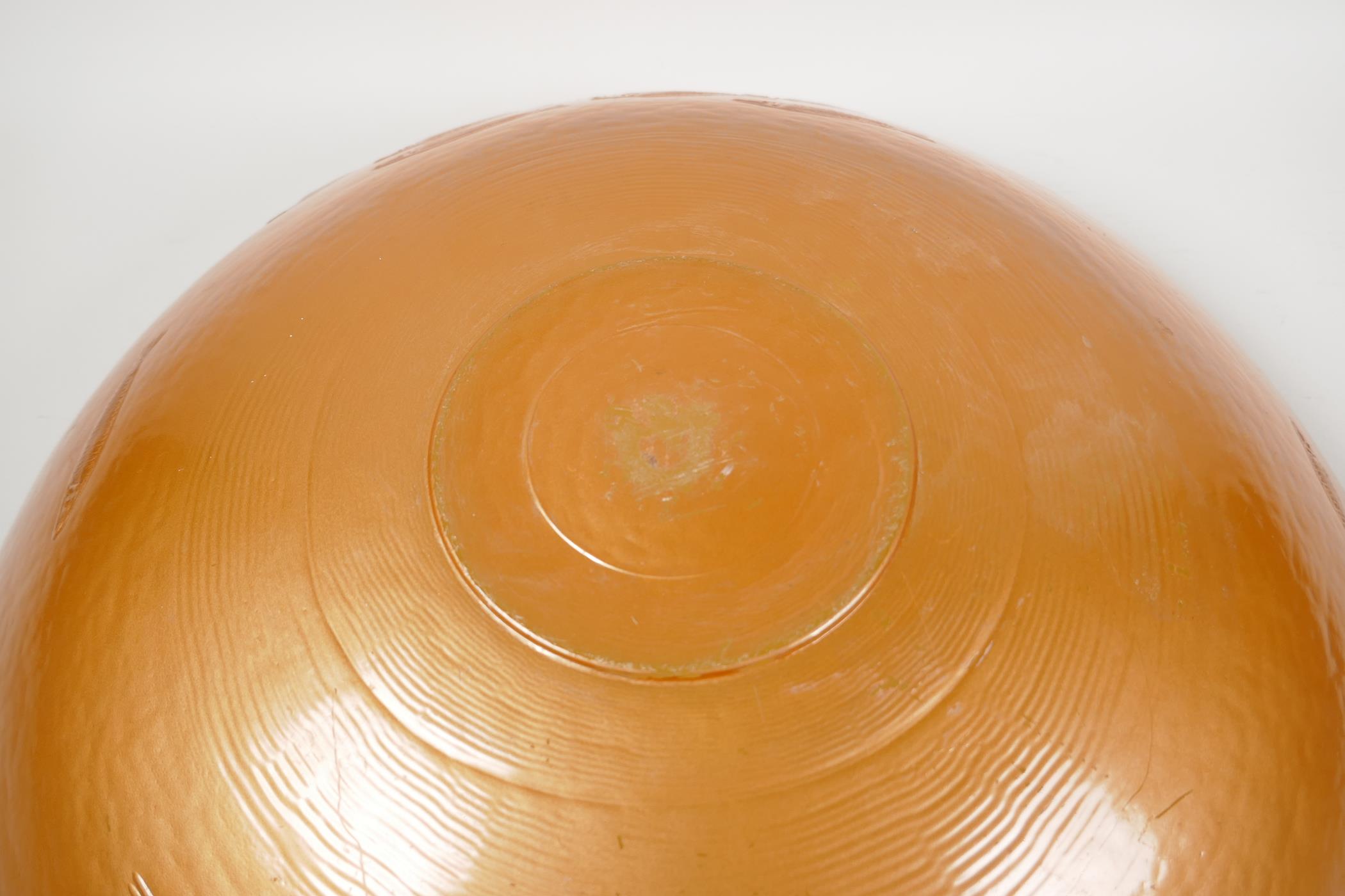 A large amber glass centrepiece bowl, embossed with a shoal of fish, 19" diameter - Image 4 of 4