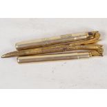A pair of gilt metal folding curling tongs with hallmarked silver handles, London 1905, in a