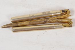A pair of gilt metal folding curling tongs with hallmarked silver handles, London 1905, in a