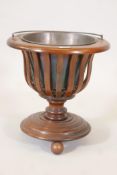 A C19th inlaid mahogany cellarette raised on three ball feet with brass liner, 15" high x 15" deep