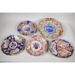 A C19th Imari porcelain charger painted with figures 12" diameter, together with an oval dish