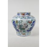 A Doucai porcelain jar decorated with mythical creatures in a floral backdrop, Chinese Wanli six