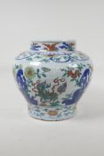 A Doucai porcelain jar decorated with mythical creatures in a floral backdrop, Chinese Wanli six
