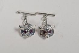A pair of sterling silver cufflinks in the form of owls