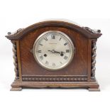 An oak cased chiming mantel clock from Mappin & Webb, with barley twist turned side columns, 12½"