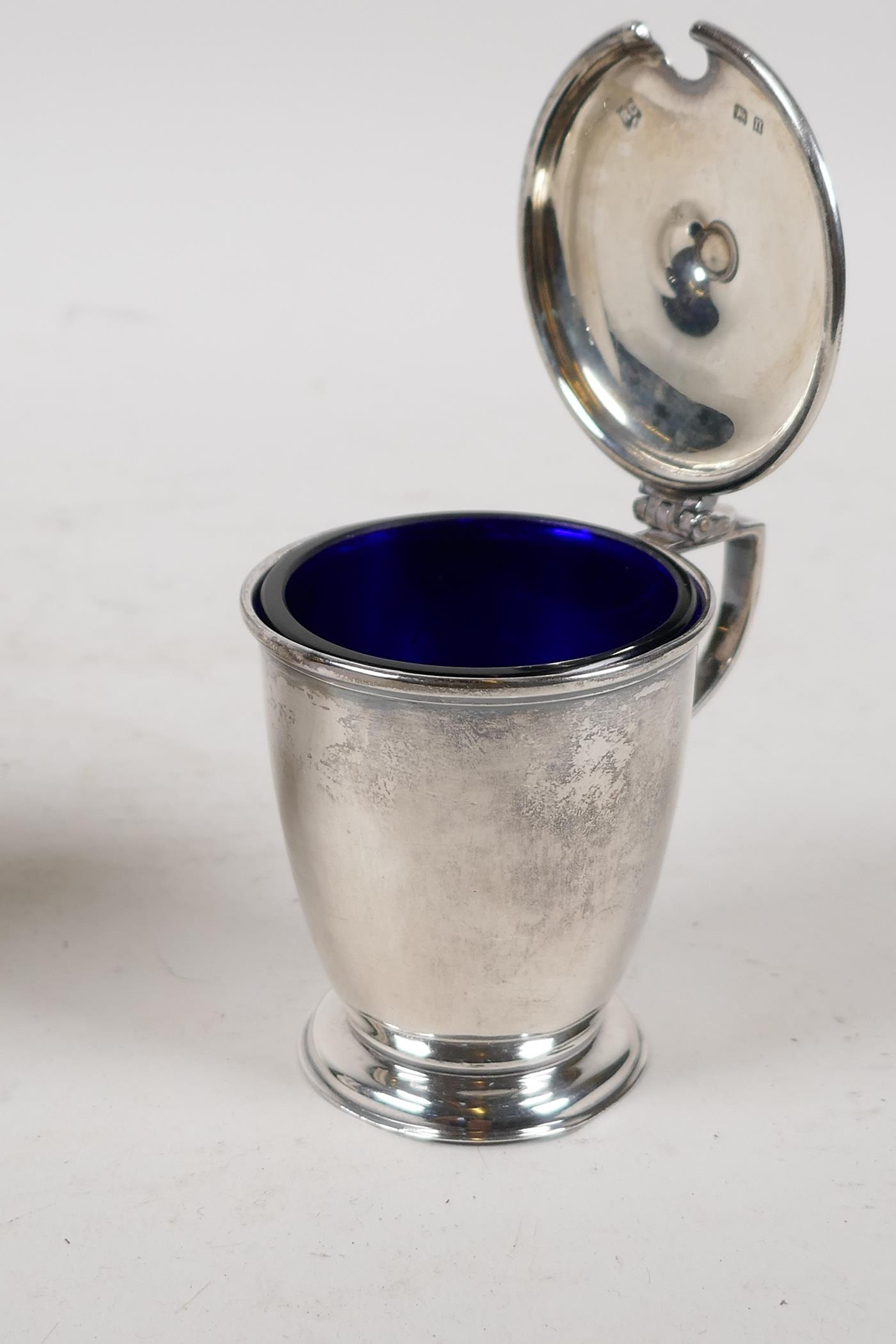 A hallmarked silver sauce boat, Birmingham 1924, and a silver mustard pot with blue glass liner, - Image 5 of 6