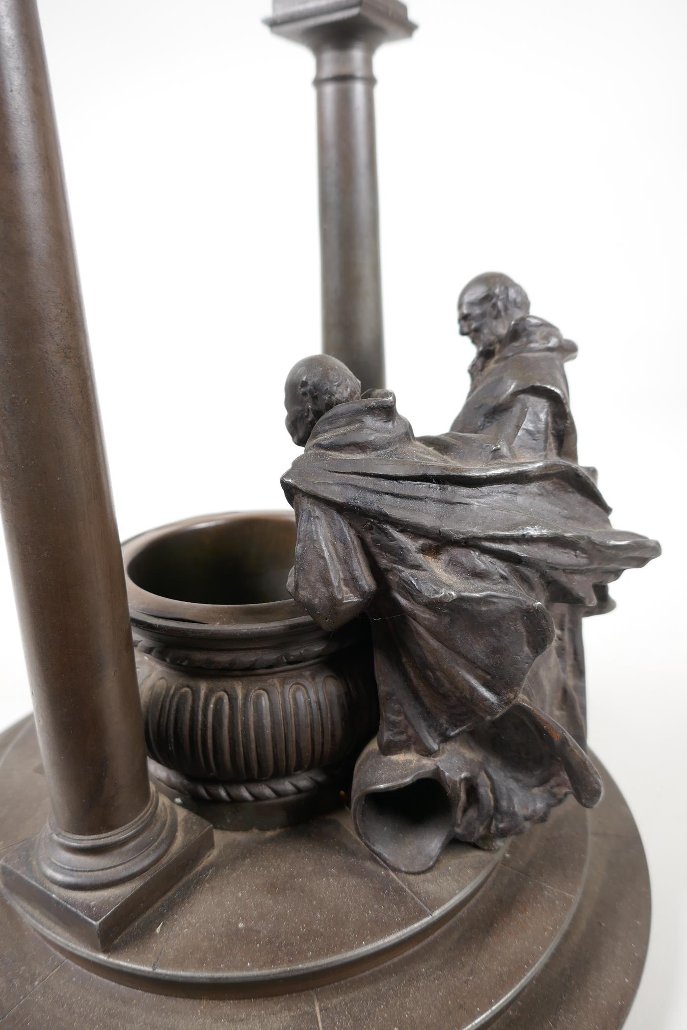 A bronze stand cast as two classical figures looking into a well, 10" diameter, 11" high - Image 5 of 6