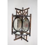 A C19th bamboo and lacquer corner wall shelf with two bevelled glass mirrrors and two shelves,