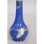 A Wedgwood lustre fish vase with design after Daisy Makeig Jones, A/F restoration to neck, 8" high