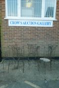 A set of six wrought iron garden chairs and matching table base, A/F, lack seats
