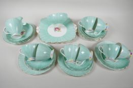 A Foley China eight place setting tea service, with two square section serving plates, cream jug and