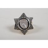 A silver gilt ring in the form of St David's star, set with a large uncut diamond, size 'P'