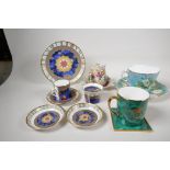 A Royal Worcester porcelain Millenium trio, two pin trays and a candleholder, an Aynsley