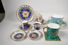 A Royal Worcester porcelain Millenium trio, two pin trays and a candleholder, an Aynsley