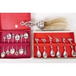 A hallmarked silver handled brush, London 1906, together with a set of six unmarked silver and jewel