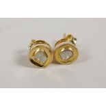 A pair of silver gilt uncut diamond studs