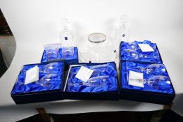 A quantity of Edinburgh Crystal to include a square cut decanter and four tumblers engraved for