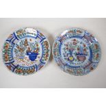 Two C18th Delft dished plates painted in bright enamels, 9" diameter