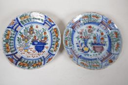 Two C18th Delft dished plates painted in bright enamels, 9" diameter