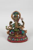 An Indian brass figure of Ganesh with painted highlights and set with semi precious stones, mark