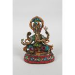 An Indian brass figure of Ganesh with painted highlights and set with semi precious stones, mark