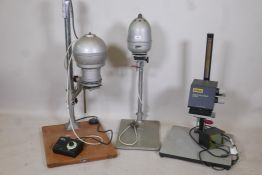 A Gamma 35 photographic enlarger, a LPL C5700 colour enlarger and another with timer