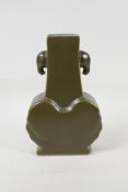 A Chinese tea dust glazed porcelain vase with two elephant mask handles, six character mark to base,