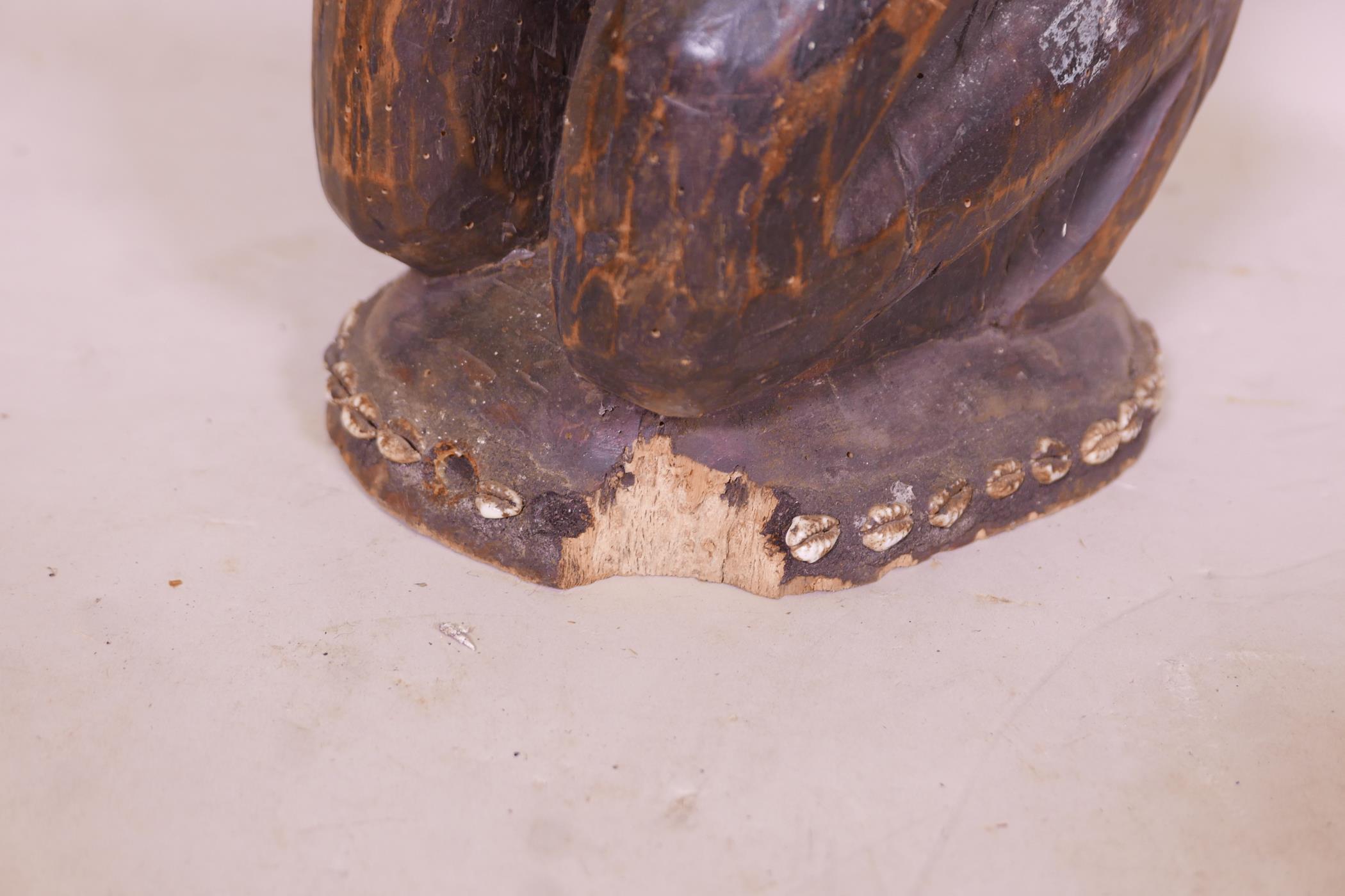 An antique African carved wood fertility figure with beaded headdress and inset with sea shells, - Image 2 of 5