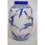A Keralouve Art Deco style ceramic vase decorated with a frieze of leaping gazelles, stamped