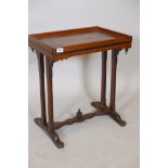 A C19th mahogany side table, with painted and parcel gilt top and shaped frieze, raised on end