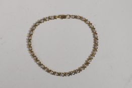 A yellow gold and diamond set link bracelet, probably 10ct, 6½" long