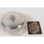 A cut glass dressing table jar with hallmarked silver cover, London 1930, 65g, and a pierced and
