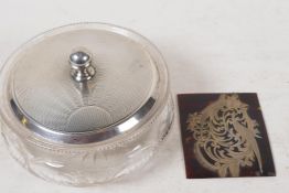 A cut glass dressing table jar with hallmarked silver cover, London 1930, 65g, and a pierced and