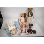 An Armand Marseille 351/2K black baby doll, a 341/3K baby doll, a British made ceramic doll with